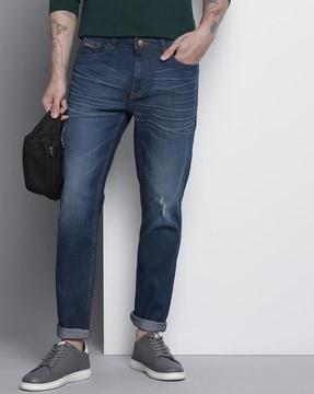 mid-wash slim fit distressed jeans