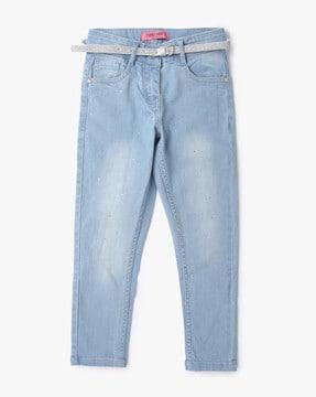 mid-wash slim fit jeans with belt
