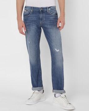 mid-wash slim fit jeans with distress