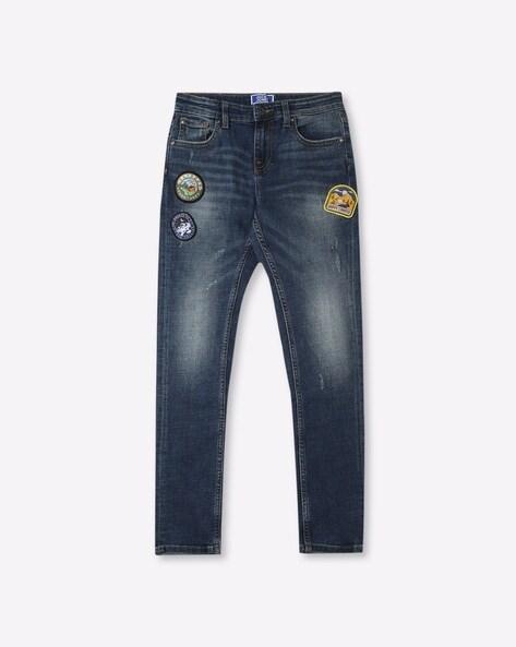 mid-wash distressed jeans with appliques