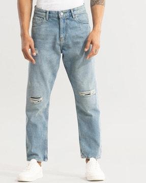 mid-wash distressed relaxed jeans