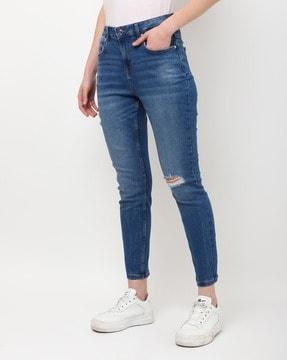 mid-wash distressed skinny fit jeans