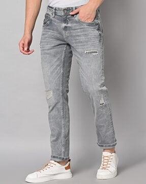mid-wash distressed skinny fit jeans