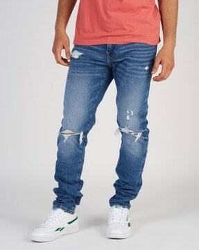 mid-wash distressed skinny jeans