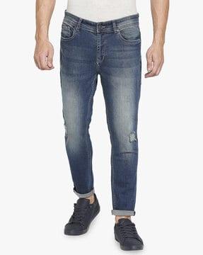 mid-wash distressed slim fit jeans