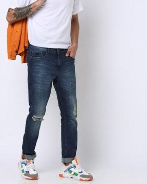 mid-wash distressed slim fit jeans