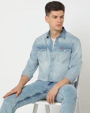 mid-wash distressed slim fit shirt with flap pockets