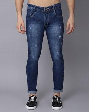 mid-wash distressed slim jeans