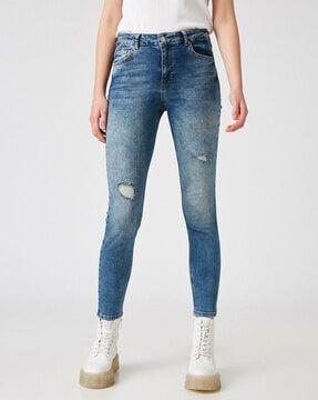 mid-wash high-rise distressed skinny fit jeans