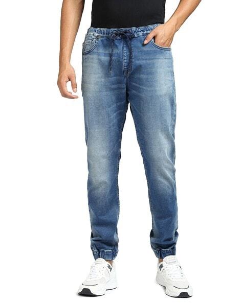 mid-wash jeans with drawstring waist