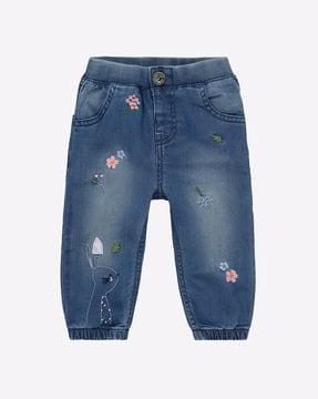 mid-wash jeans with embroidery