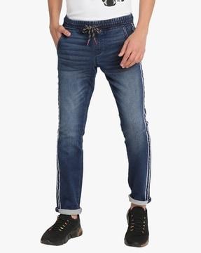 mid-wash jeans with side tape detail