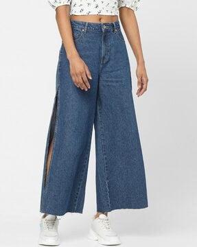 mid-wash jeans with slits