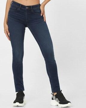 mid-wash low-rise skinny jeans