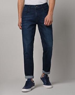 mid-wash low-rise tapered fit jeans