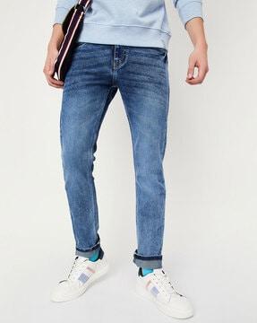 mid wash mid-rise slim jeans