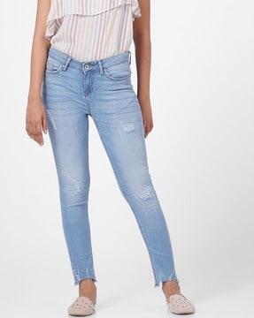 mid-wash skinny fit distressed jeans