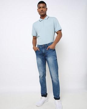 mid-wash skinny fit jeans with whiskers