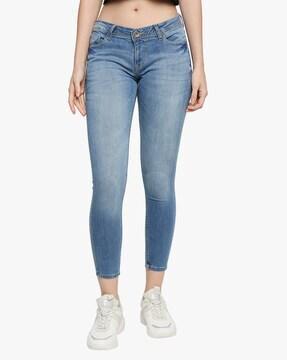 mid-wash skinny fit jeans