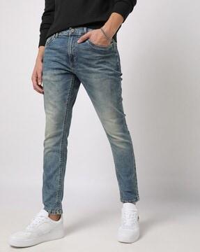 mid-wash skinny fit jeans