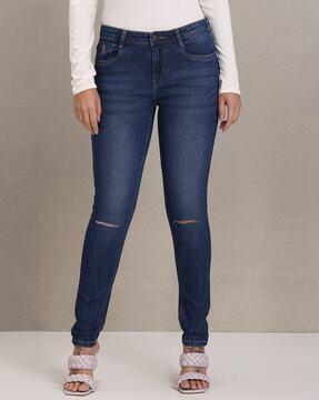 mid-wash skinny fit jeans