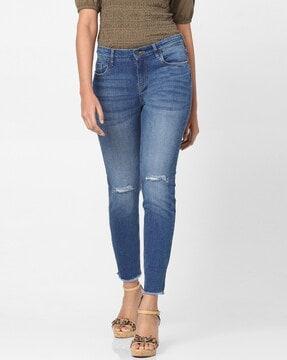 mid-wash skinny fit jeans