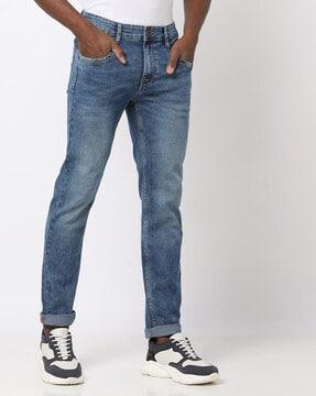 mid-wash skinny fit jeans