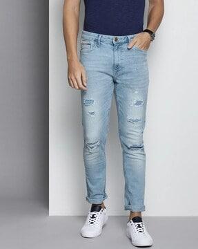 mid-wash slim fit distressed jeans