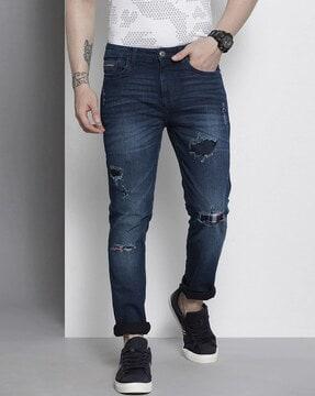 mid-wash slim fit distressed jeans