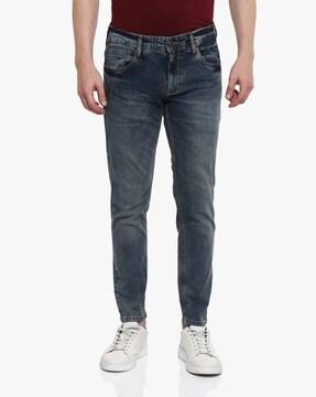 mid-wash slim fit jeans with button closure