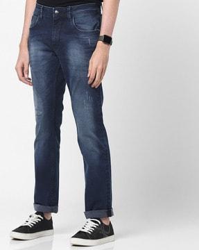 mid-wash slim fit jeans with distressing