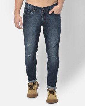 mid-wash slim jeans with 5-pocket styling