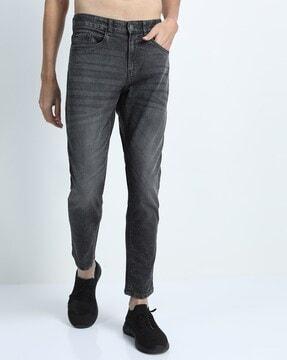 mid-wash tapered fit jeans