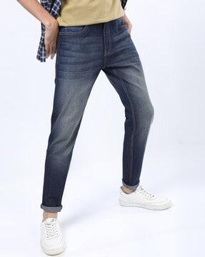 mid-wash tapered fit jeans