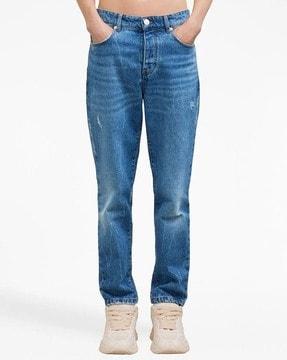 mid-wash tapered fit jeans