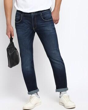 mid-wash tapered jeans 