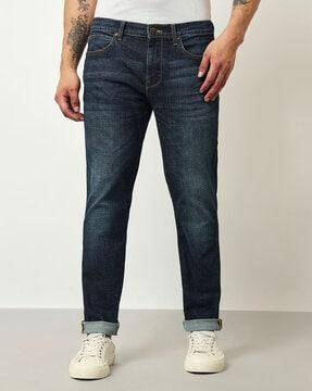 mid-wash tapered jeans