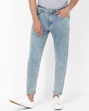 mid-washed ankle-length tapered fit jeans