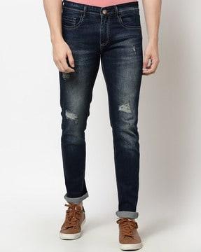 mid-washed distressed slim jeans
