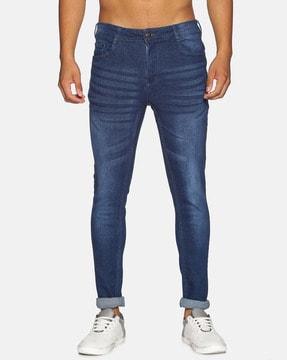 mid-washed tapered jeans with 5 pocket styling