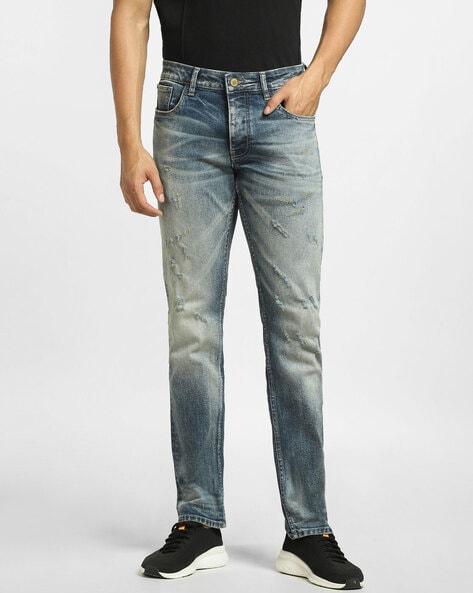 mid-washed distressed jeans