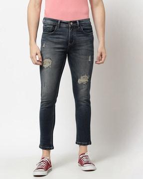 mid-washed distressed slim jeans