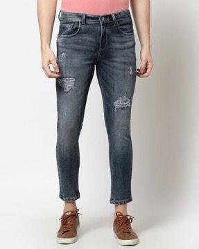 mid-washed distressed slim jeans