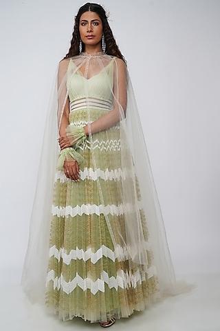 mint green embroidered gown with cape