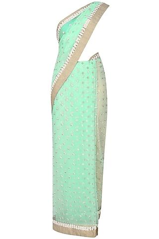 mint green zari hand embroidered saree with sea green kundan and pearl work embedded blouse