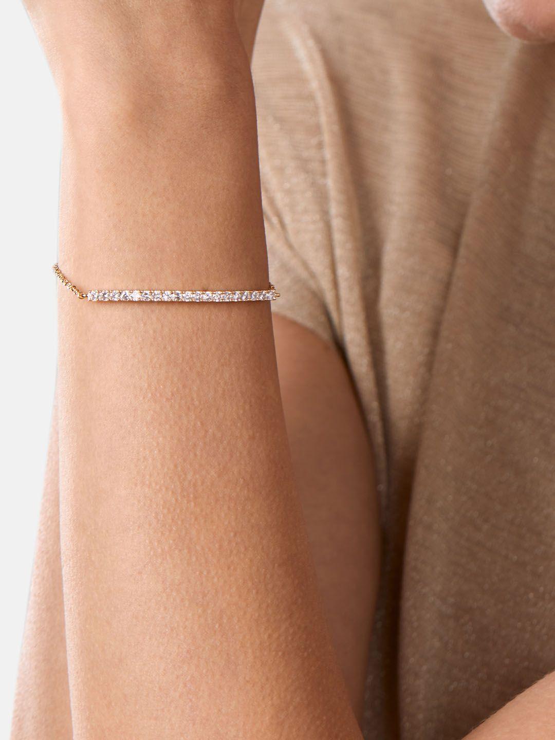minutiae women gold-toned & white crystals studded link bracelet