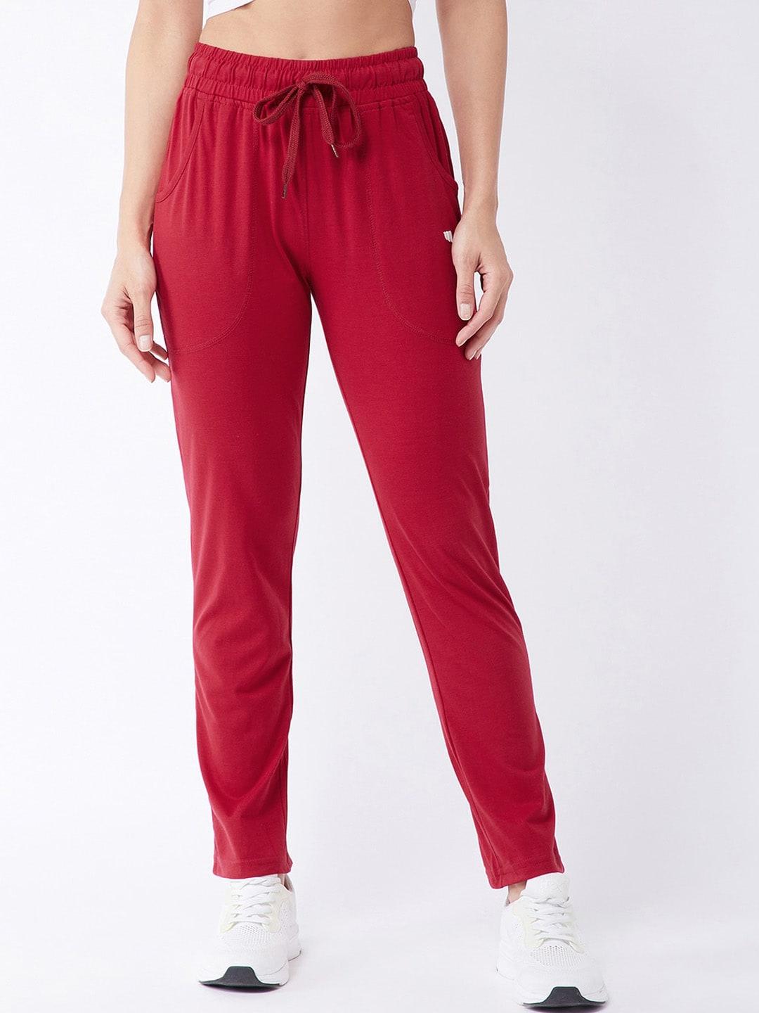 modeve women red solid regular fit track pants