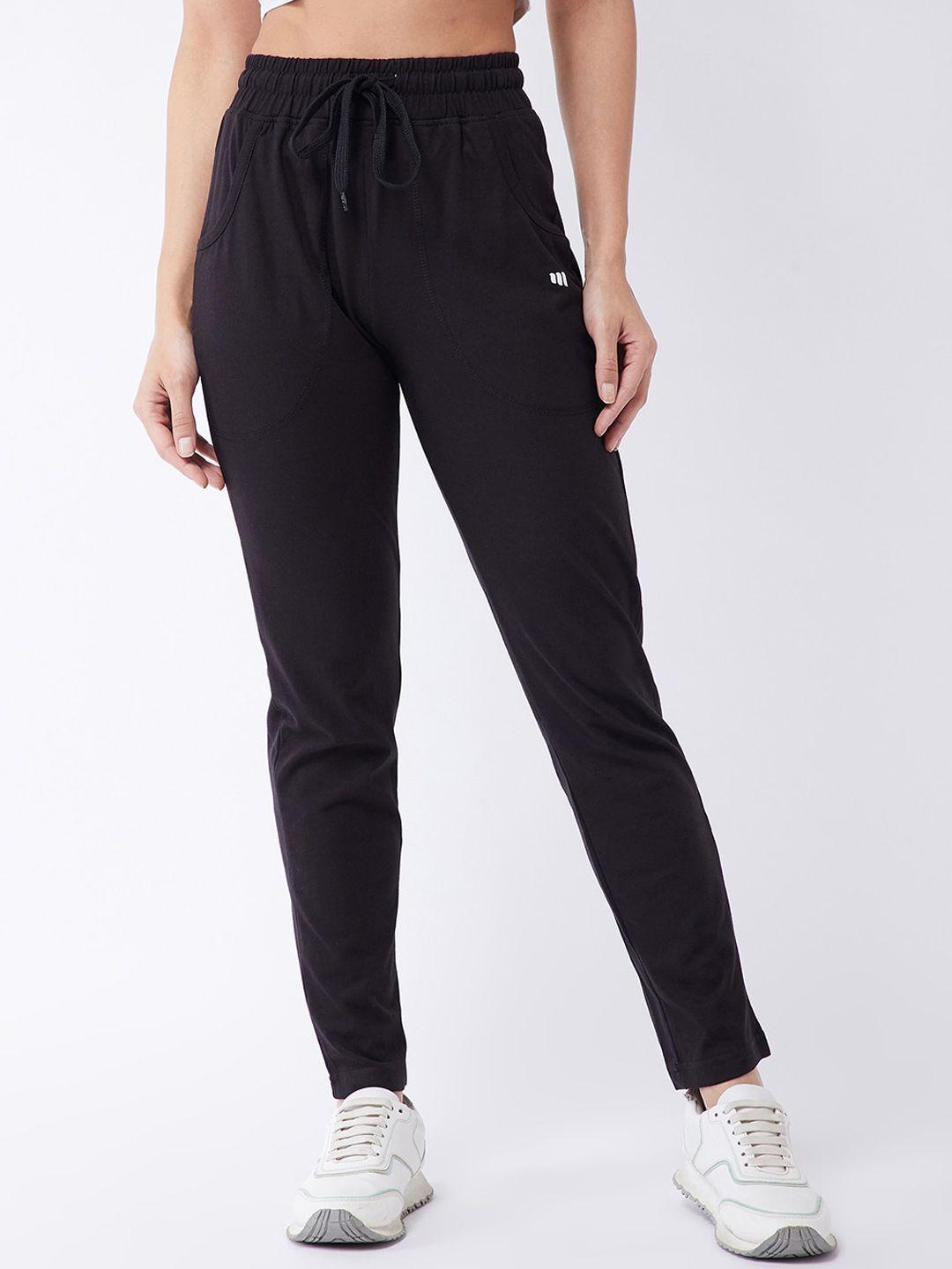 modeve women black solid regular fit track pants