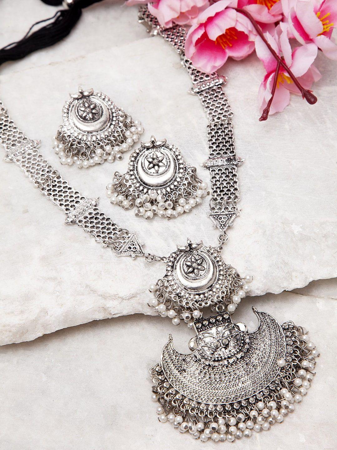 moedbuille silver-toned pearls studded layered tasselled design filigree work tribal temple jewellery set