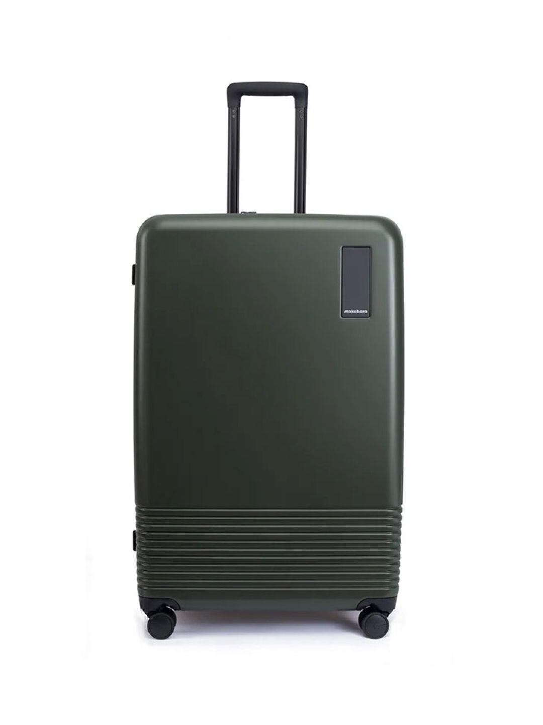 mokobara green textured hard-sided large trolley suitcase